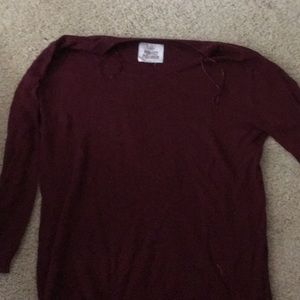 A long sleeve burgundy sweater